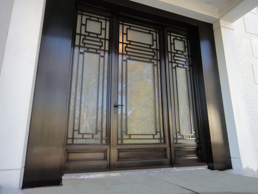 Monumental Bronze Entry Door with Sidelights.